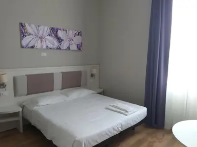 Letto o letti in una camera di Lodges le Mura