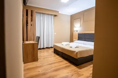 Letto o letti in una camera di EURHOTEL
