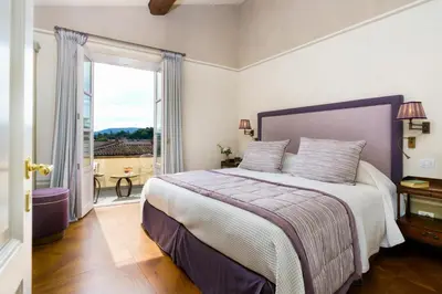Letto o letti in una camera di Donna Lipsi - La Dimora degli Affreschi Florence