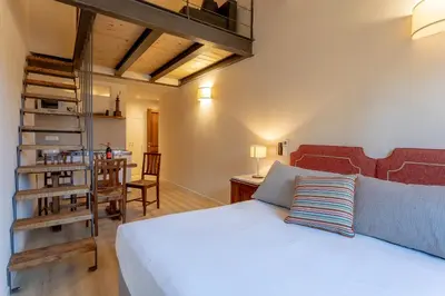 Letto o letti in una camera di Ramaglianti Apartments Suite Tre
