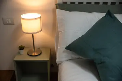 Letto o letti in una camera di Casa Barco Firenze
