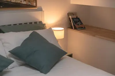 Letto o letti in una camera di Casa Barco Firenze