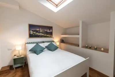 Letto o letti in una camera di Casa Barco Firenze
