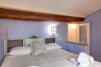 Letto o letti in una camera di Casper Apartment by Mamo Florence