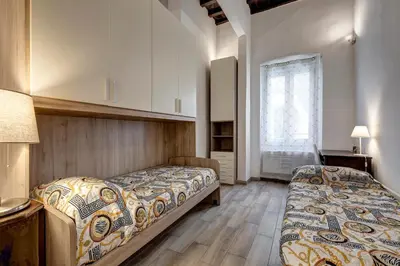 Letto o letti in una camera di La casina delle 6M