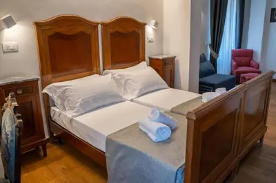 Letto o letti in una camera di Residenza degli Speziali