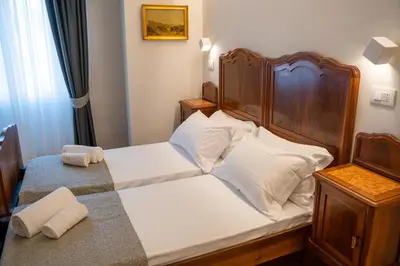 Letto o letti in una camera di Residenza degli Speziali