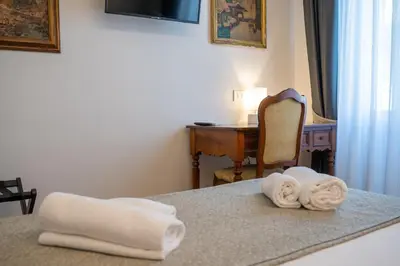 Letto o letti in una camera di Residenza degli Speziali