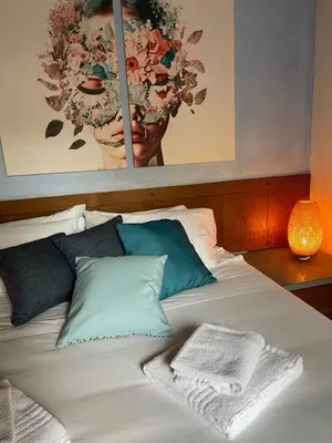 Letto o letti in una camera di Donna di Fiori Florence Home