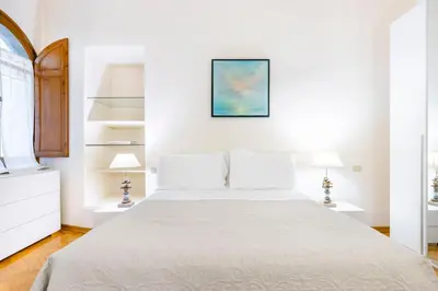 Letto o letti in una camera di Borgo San Jacopo