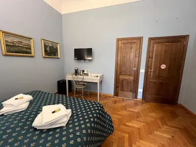 Letto o letti in una camera di B&B Beatrice
