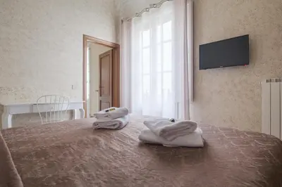 Letto o letti in una camera di B&B Beatrice