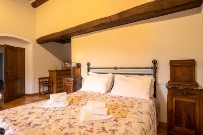 Letto o letti in una camera di Casale la Monta by VacaVilla