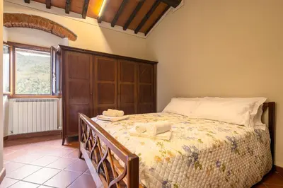 Letto o letti in una camera di Casale la Monta by VacaVilla