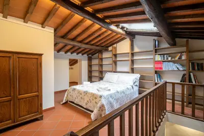 Letto o letti in una camera di Casale la Monta by VacaVilla