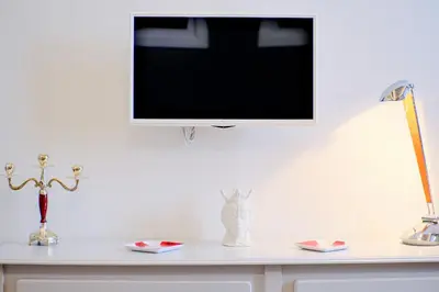 TV o dispositivi per l'intrattenimento presso Dolcevita Boutique Apartment
