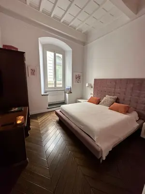 Letto o letti in una camera di Casa Orsi - appartamento fronte Duomo a Firenze