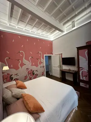 Letto o letti in una camera di Casa Orsi - appartamento fronte Duomo a Firenze