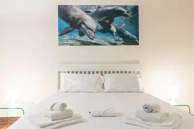 Letto o letti in una camera di Casa Florentia