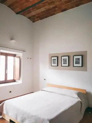 Letto o letti in una camera di La Casa nella Torre - Apartment