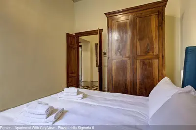 Letto o letti in una camera di Le Farine della Signoria Apartments by Mamo Florence