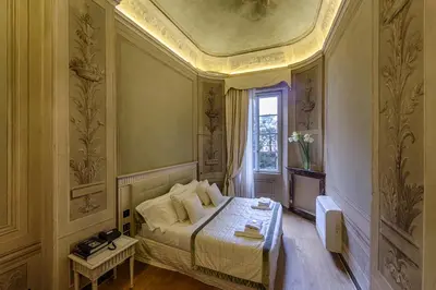 Letto o letti in una camera di Palazzo Guicciardini