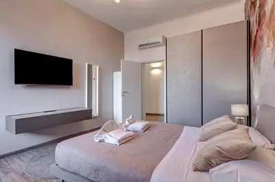Letto o letti in una camera di Micheli Apartment