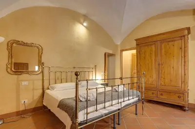 Letto o letti in una camera di Dafne Apartment by Mamo Florence