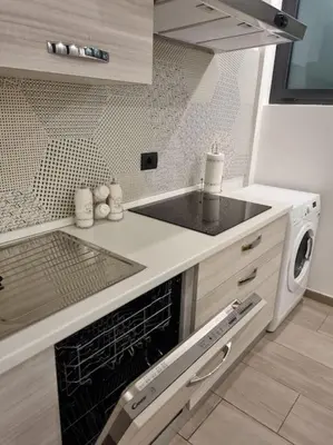 Cucina o angolo cottura di Niccolò Apartment - Firenze facilità di parcheggio