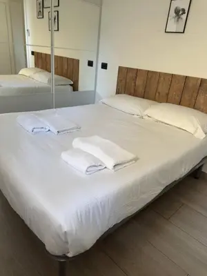 Letto o letti in una camera di Niccolò Apartment - Firenze facilità di parcheggio