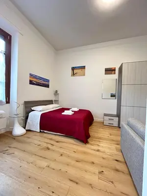 Letto o letti in una camera di FortVince Loft residential by FlorenceHospitality com