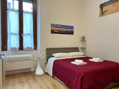 Letto o letti in una camera di FortVince Loft residential by FlorenceHospitality com