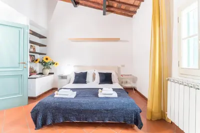Letto o letti in una camera di Casa Romana by Mmega