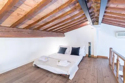 Letto o letti in una camera di Casa Romana by Mmega
