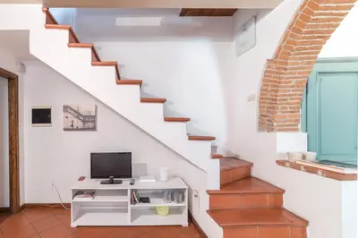 TV o dispositivi per l'intrattenimento presso Casa Romana by Mmega