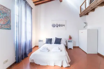 Letto o letti in una camera di Casa Romana by Mmega