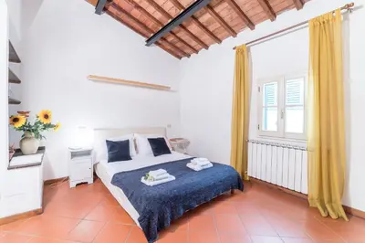 Letto o letti in una camera di Casa Romana by Mmega