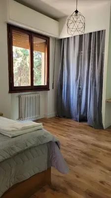 Letto o letti in una camera di Aretina Florence Villa