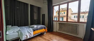 Letto o letti in una camera di Aretina Florence Villa