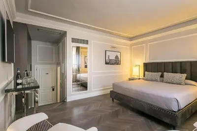 Letto o letti in una camera di Palazzo Alfieri - Place of Charme