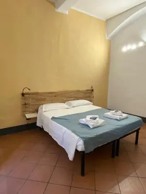 Letto o letti in una camera di da I' Gini GuestHouse