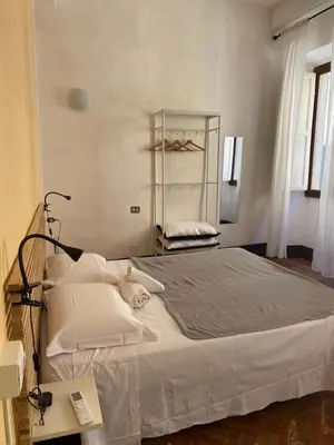 Letto o letti in una camera di da I' Gini GuestHouse