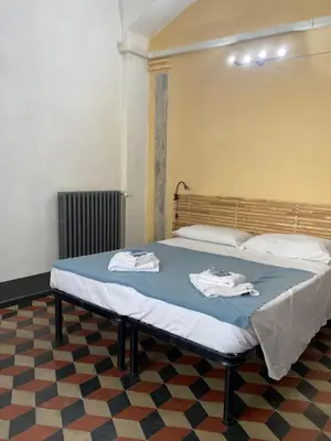 Letto o letti in una camera di da I' Gini GuestHouse