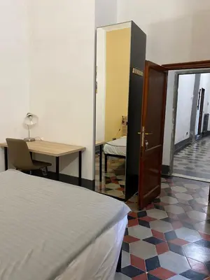 Letto o letti in una camera di da I' Gini GuestHouse