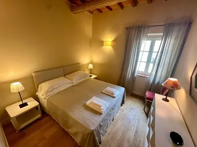 Letto o letti in una camera di Borgo dei Rosai