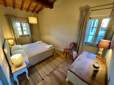 Letto o letti in una camera di Borgo dei Rosai