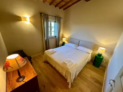 Letto o letti in una camera di Borgo dei Rosai