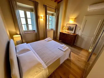 Letto o letti in una camera di Borgo dei Rosai