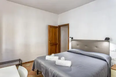 Letto o letti in una camera di Fiume & Zannoni Apartments by 360Rentals