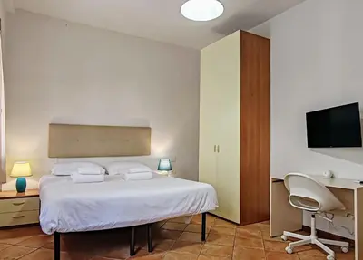 Letto o letti in una camera di Fiume & Zannoni Apartments by 360Rentals